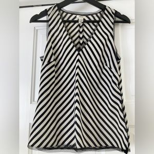 Cute light weight striped blouse with trim.